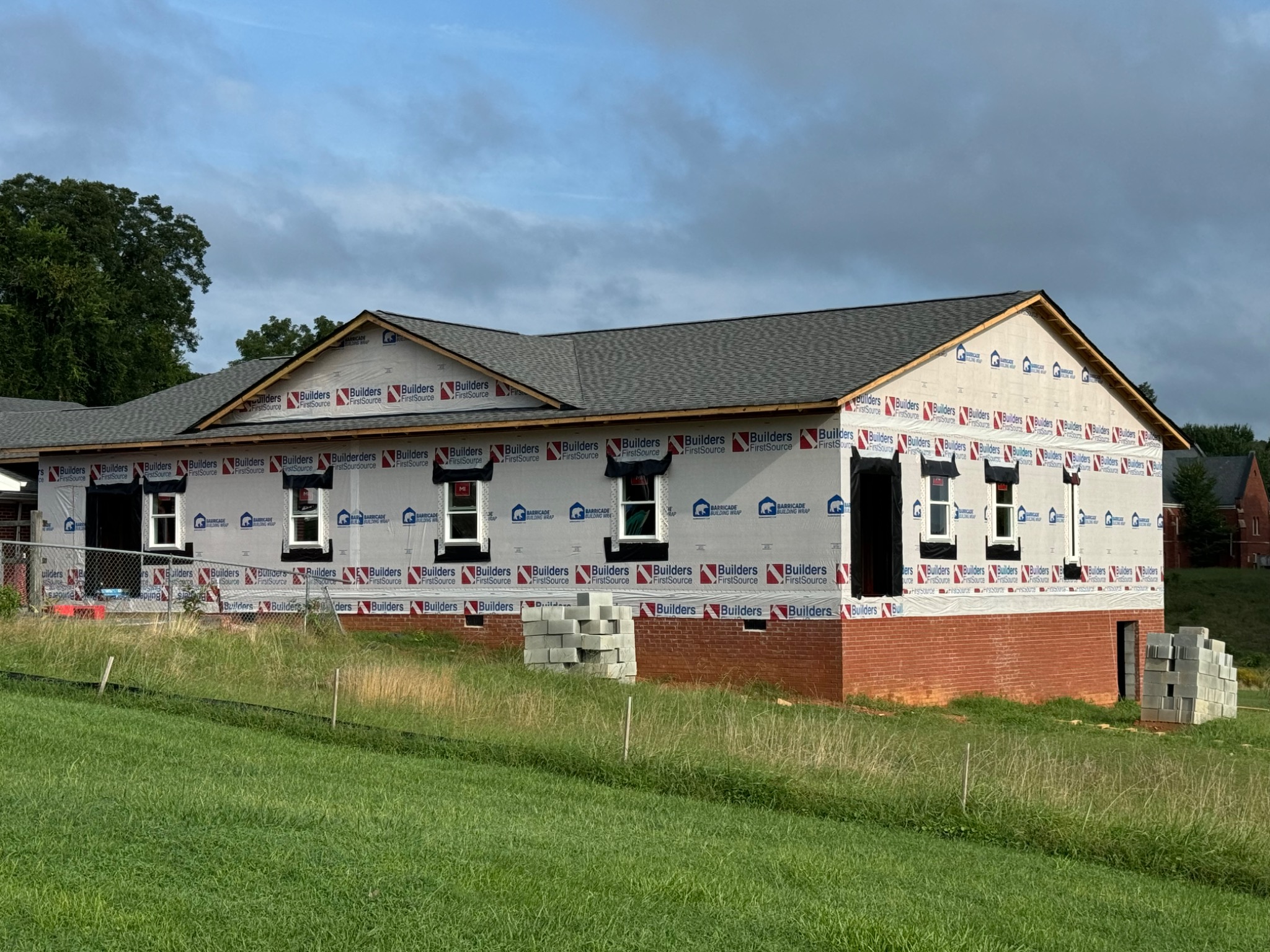 Addition exterior with roofing and windows installed