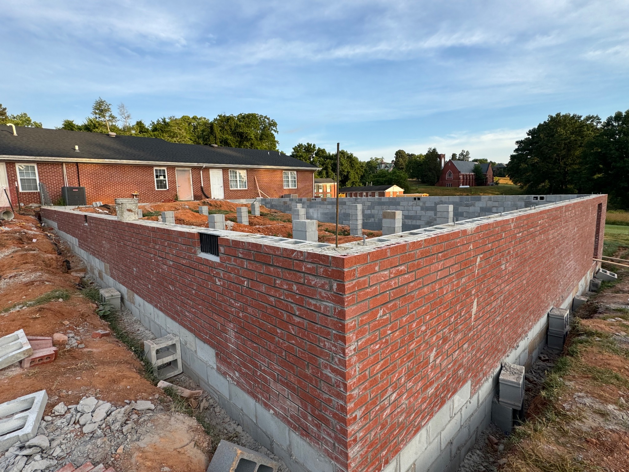 Exterior masonry wall construction on the addition