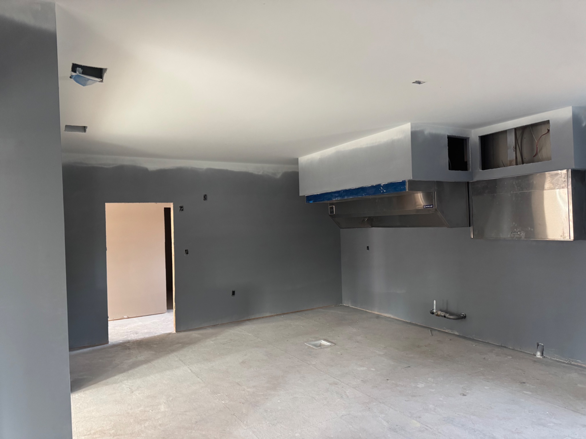 Commercial kitchen area during interior rough-in