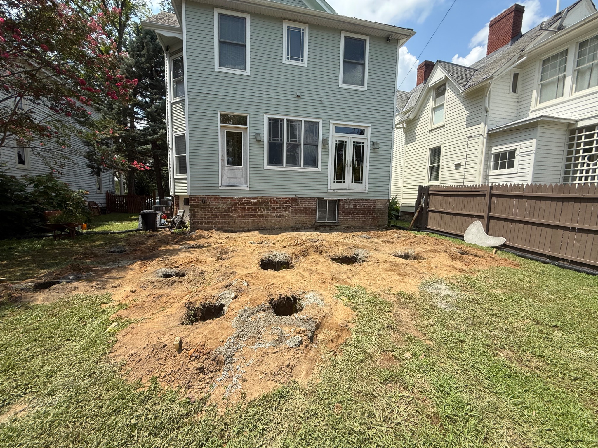 Excavated footing locations for the new deck structure