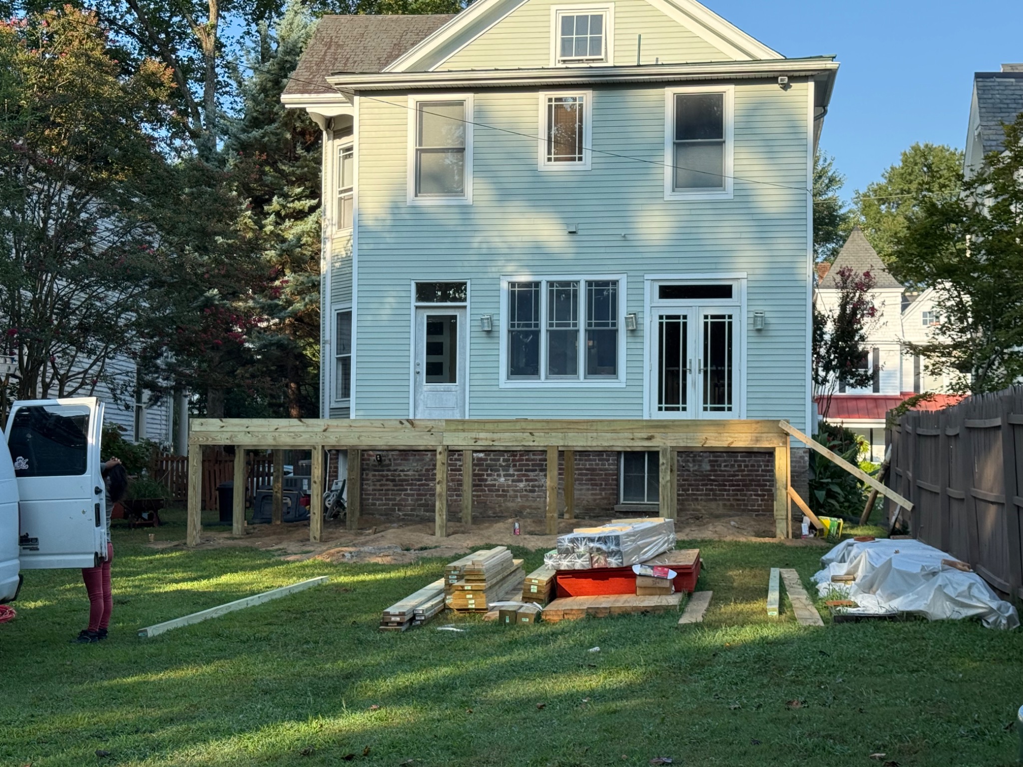 Pressure treated posts and framing for new deck platform