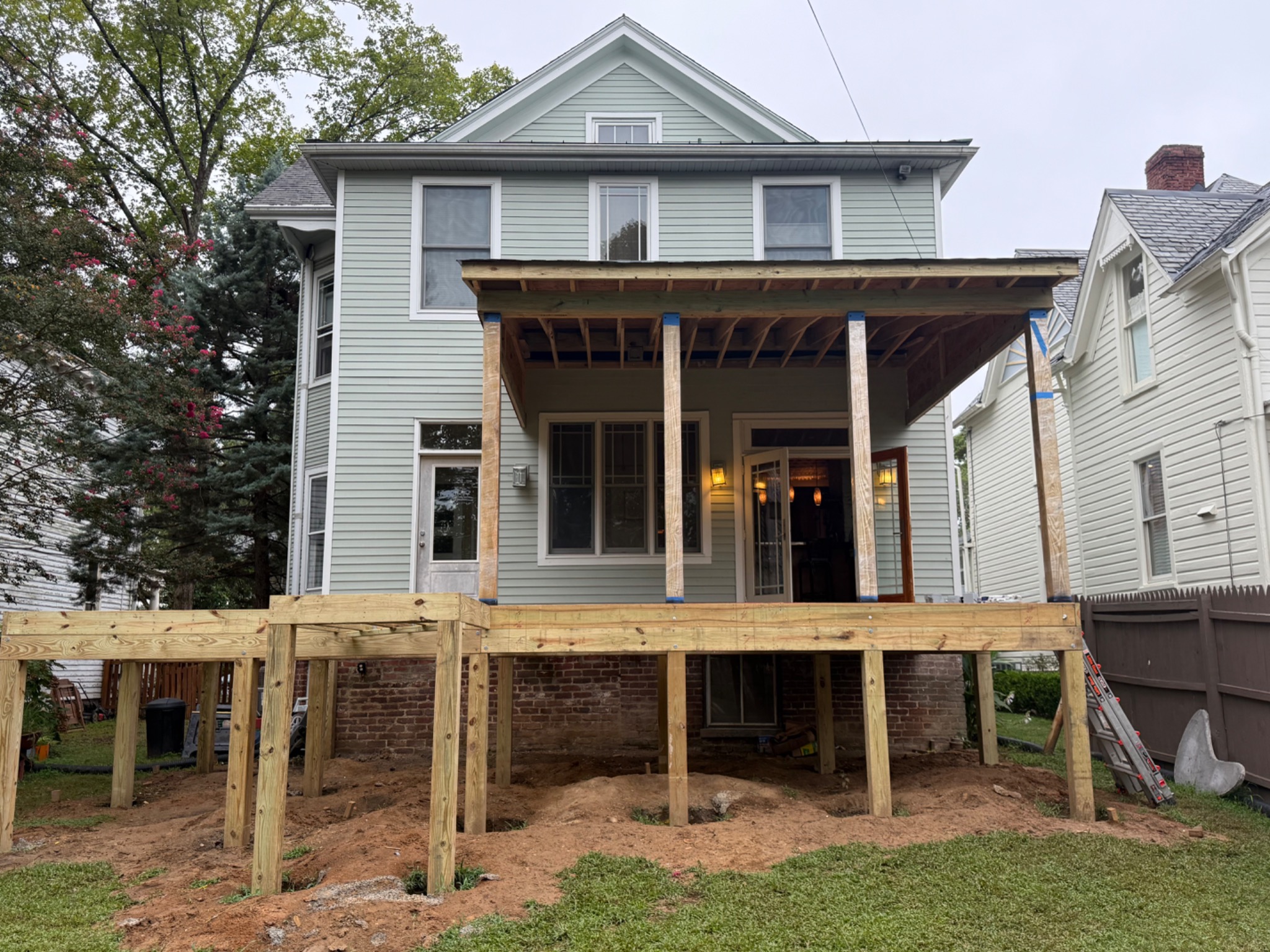 Covered porch roof structure under construction