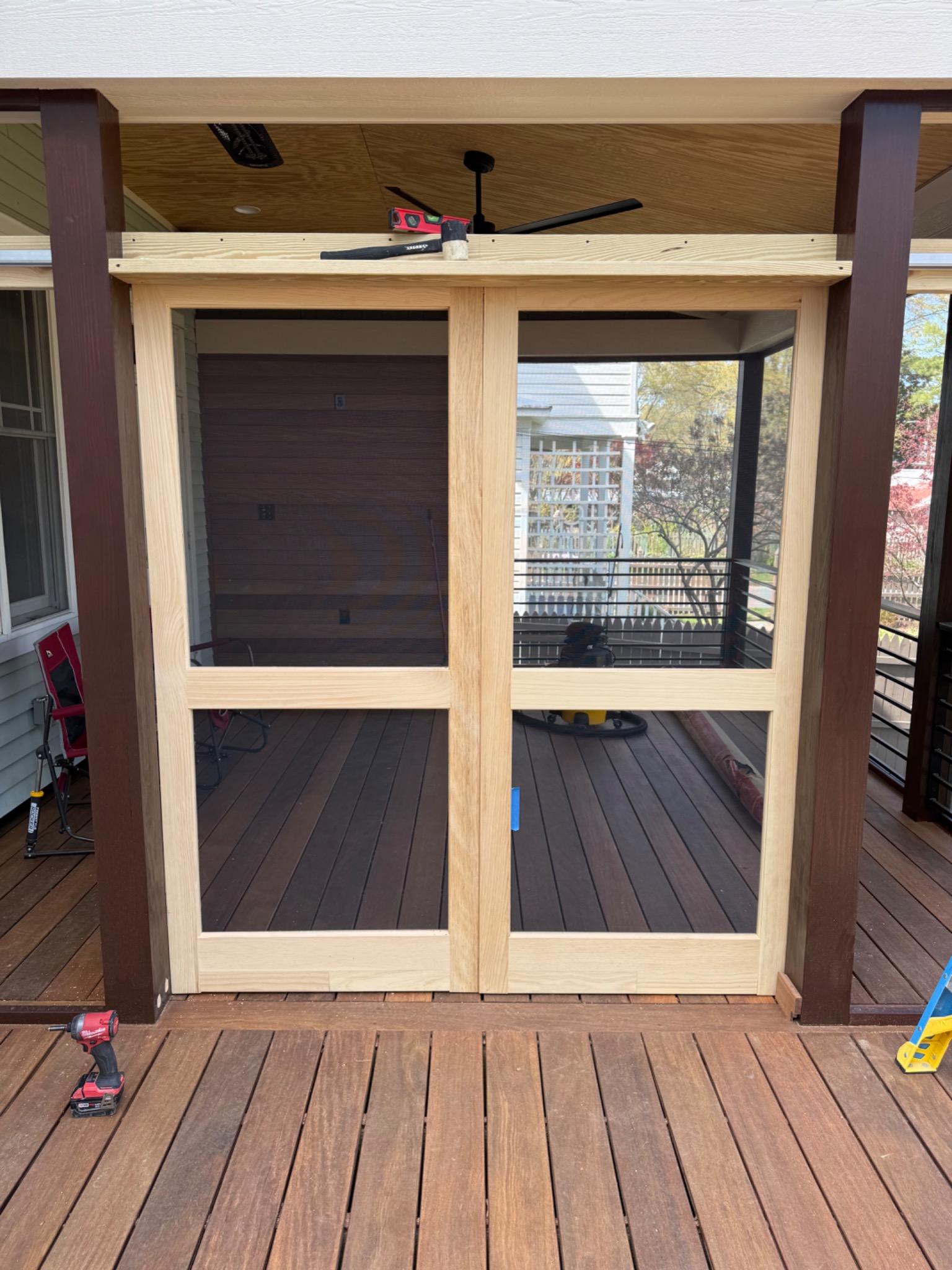 Custom wood framed screen door being fabricated