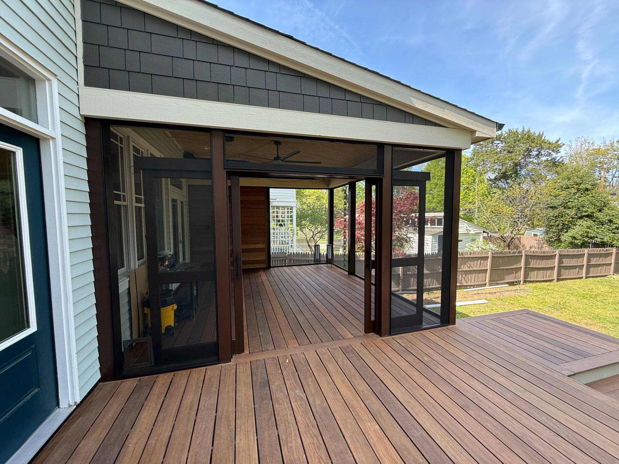 Screened porch connecting to open Balau hardwood deck