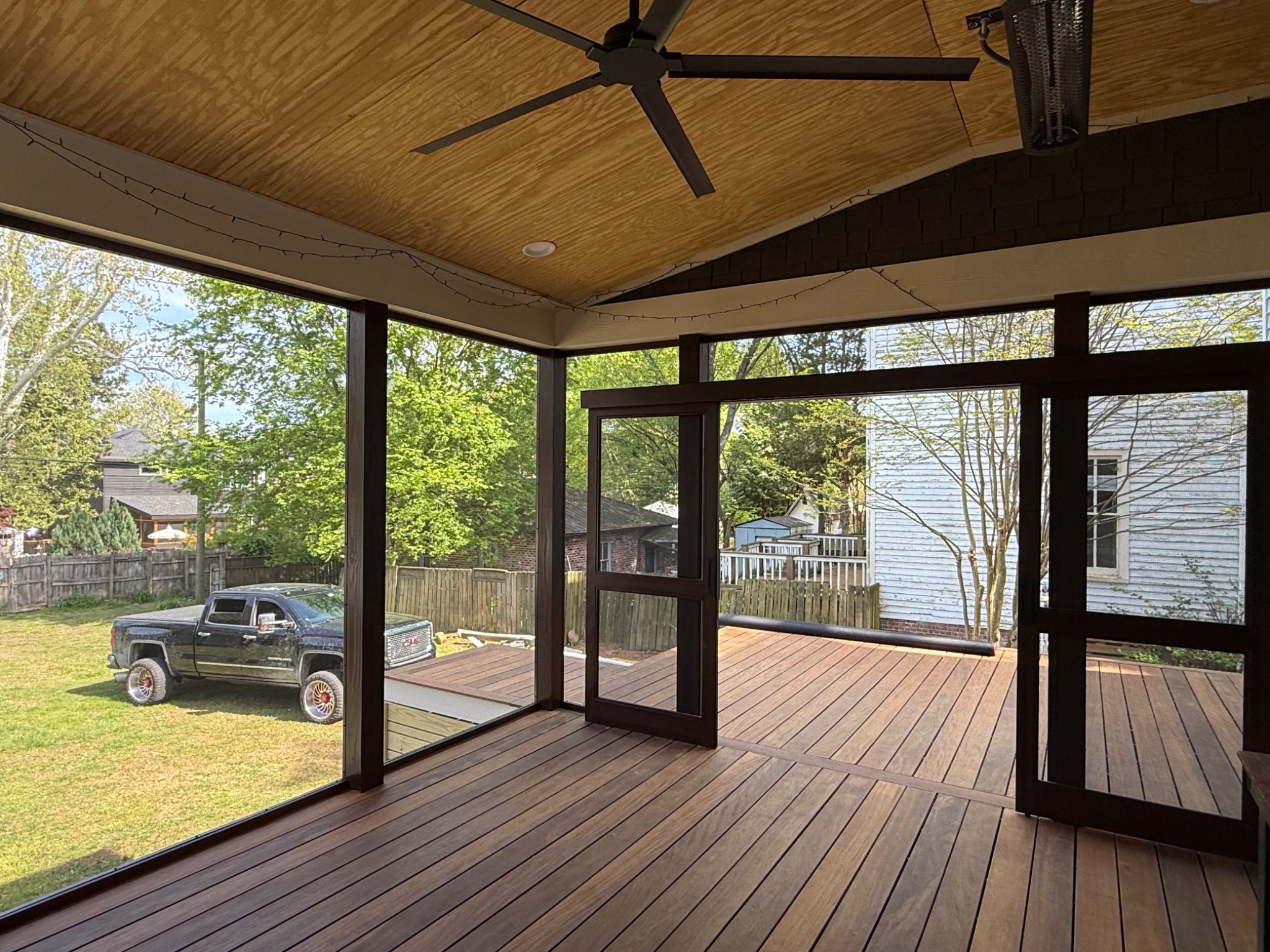 Finished screened porch interior with Balau floor and screen doors