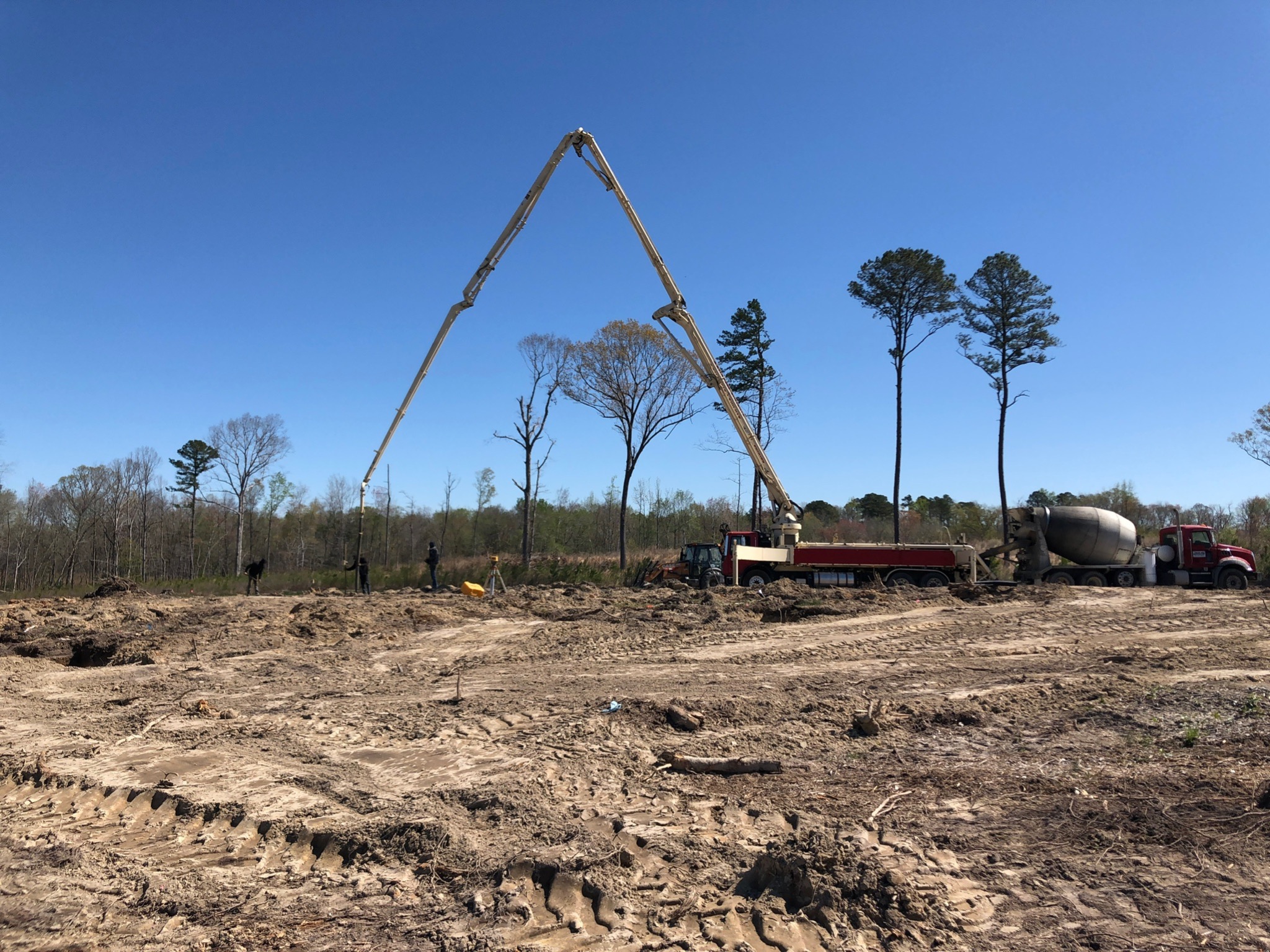 Concrete pump placing foundation concrete for custom home