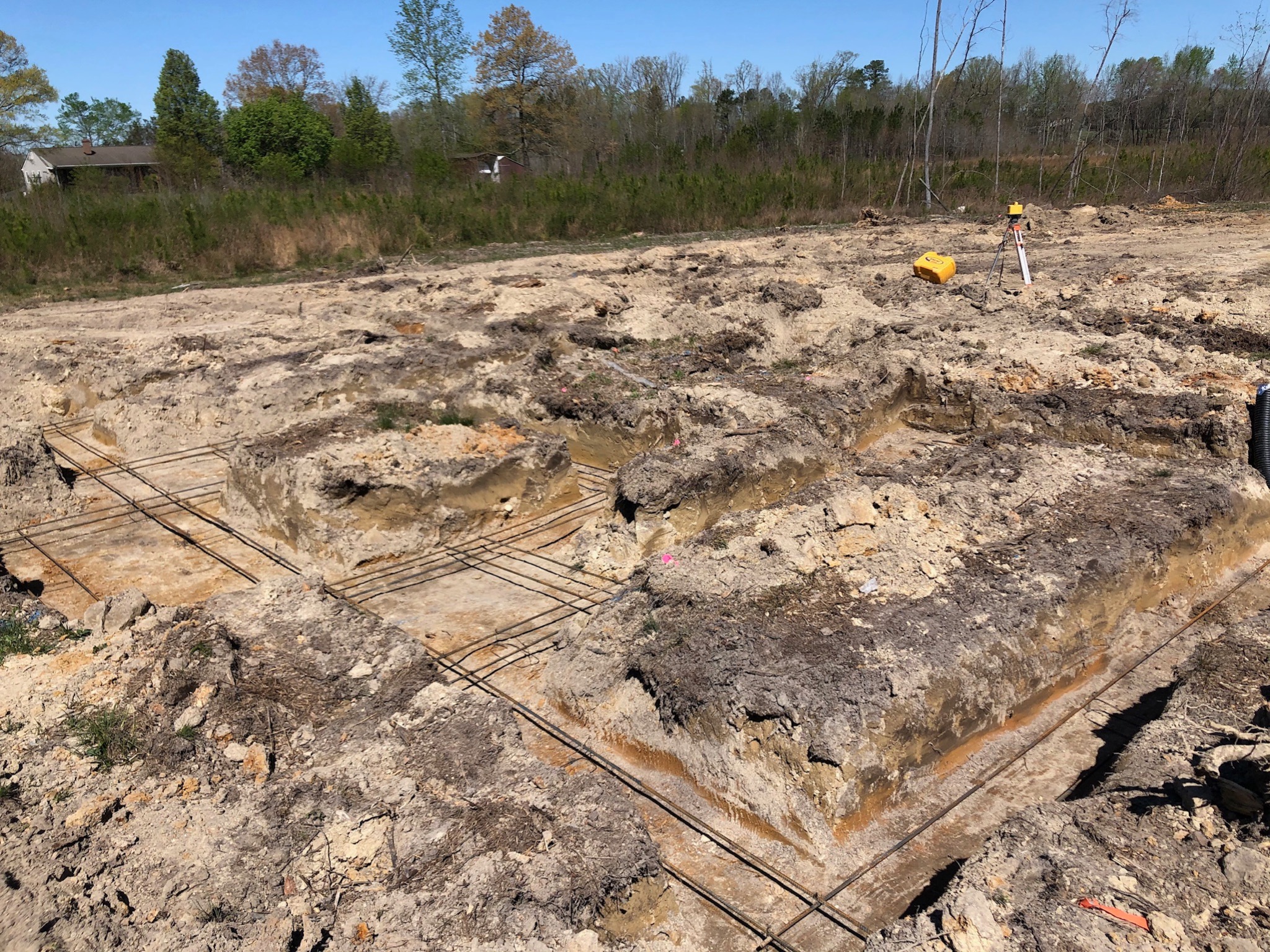 Excavated reinforced footings for custom ranch home