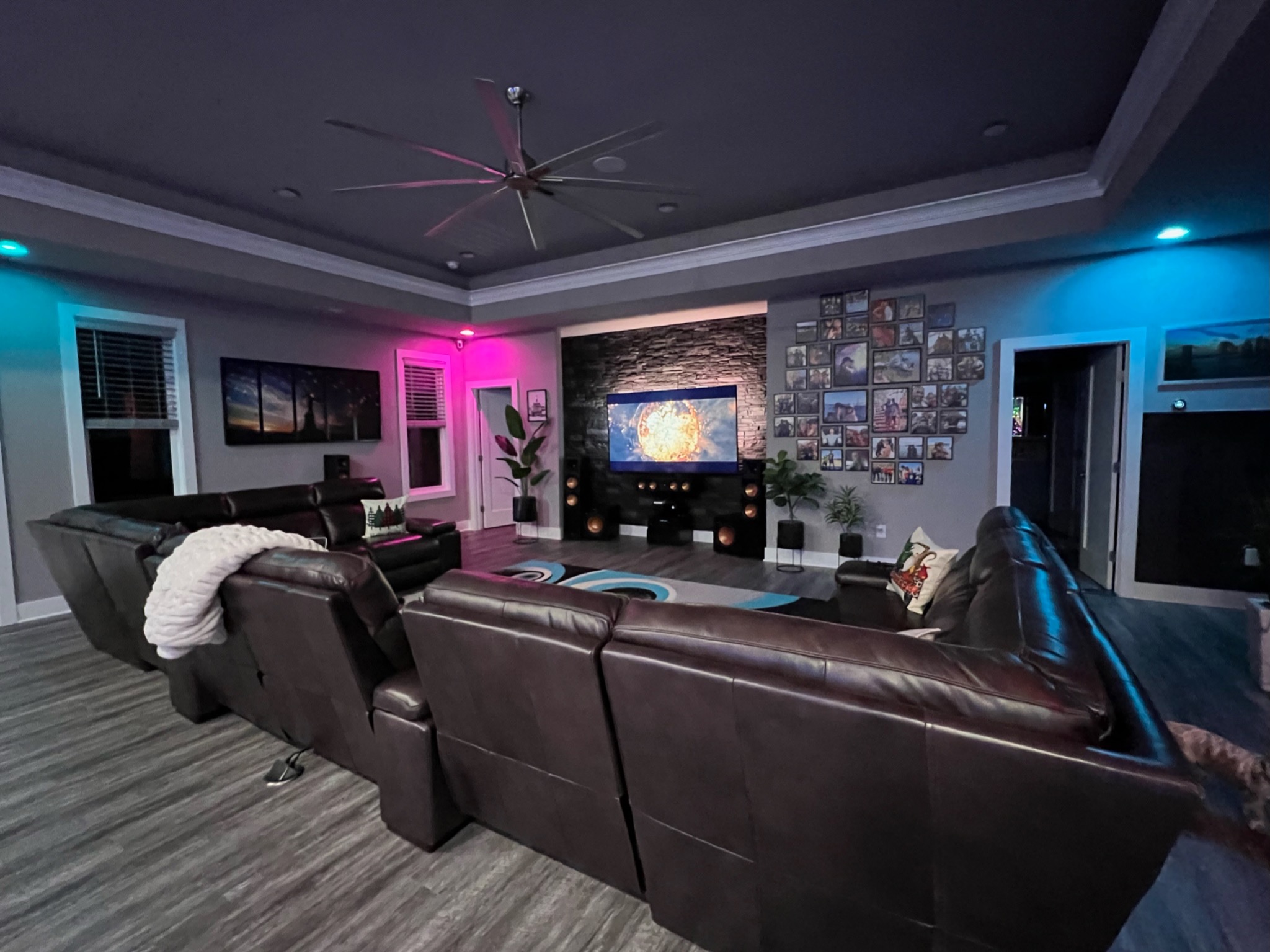 Finished great room with entertainment wall and custom lighting