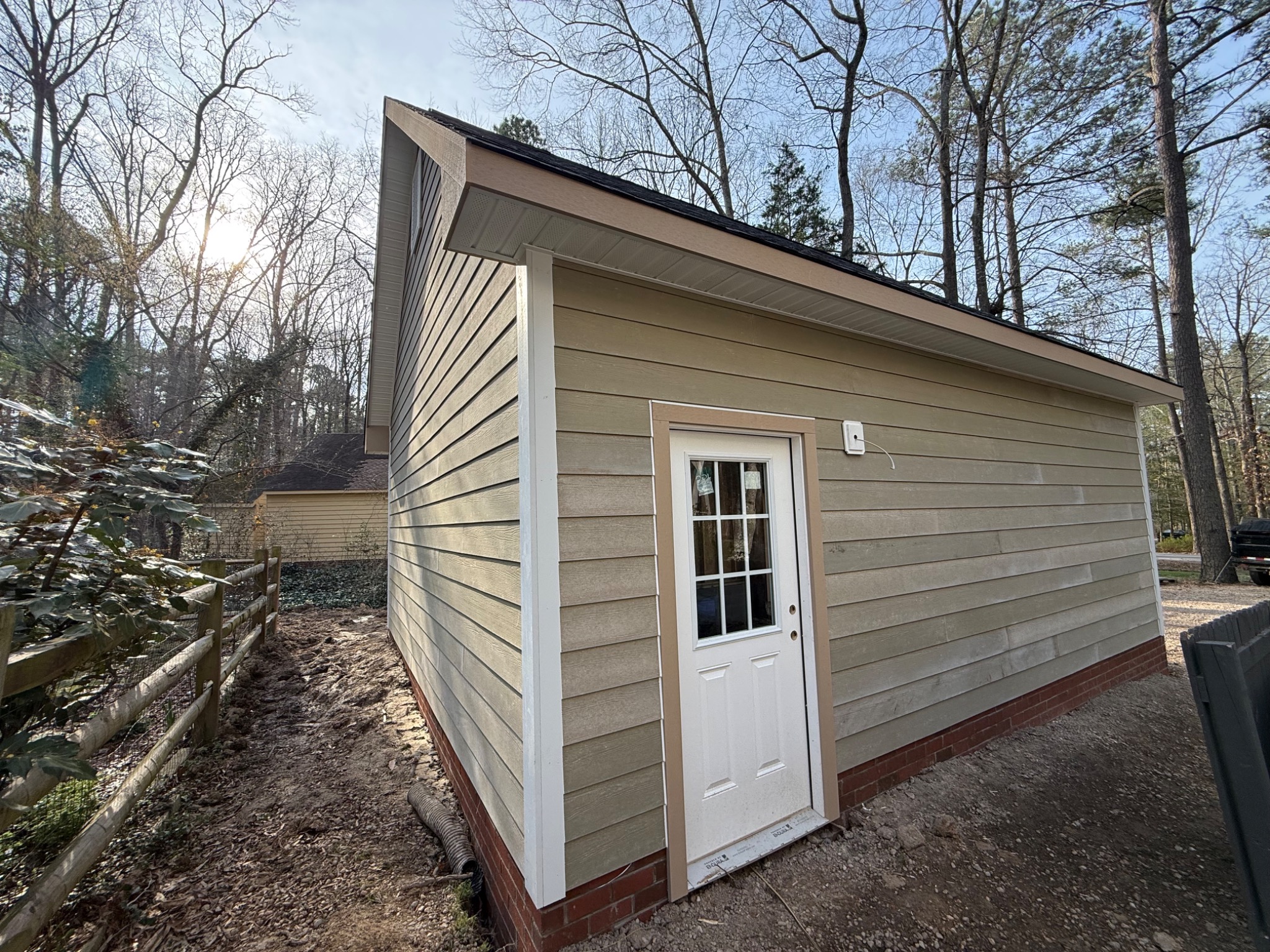 Side entry door and finished siding on detached garage