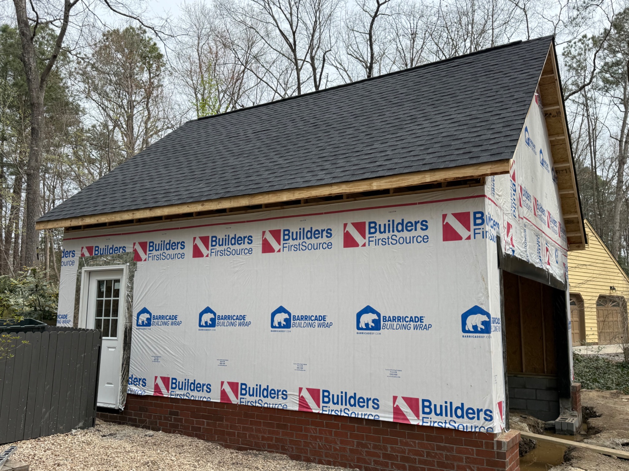 Side view of roof and weather barrier installation
