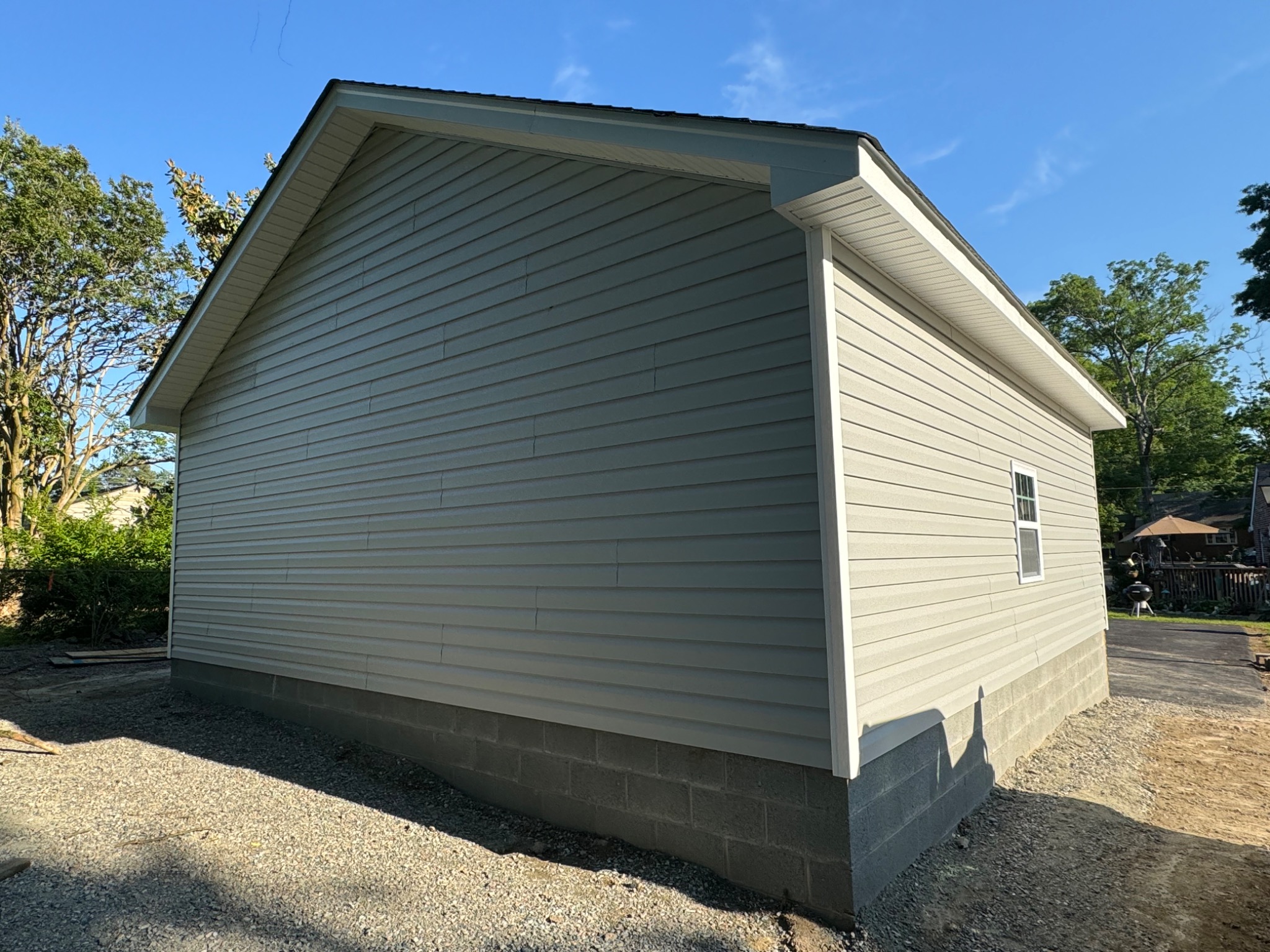 Finished side exterior of detached garage