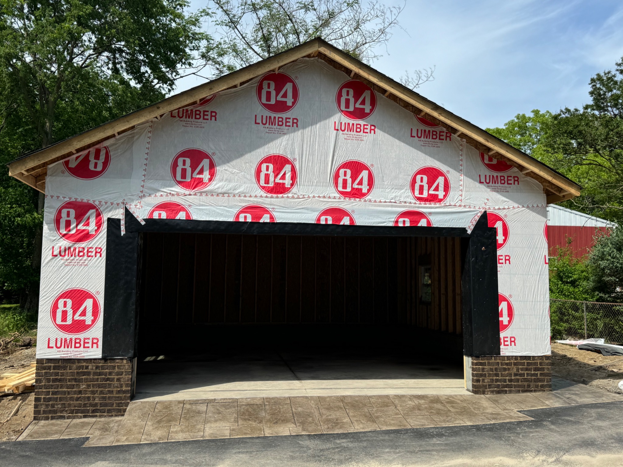 Front garage opening with weather barrier installed