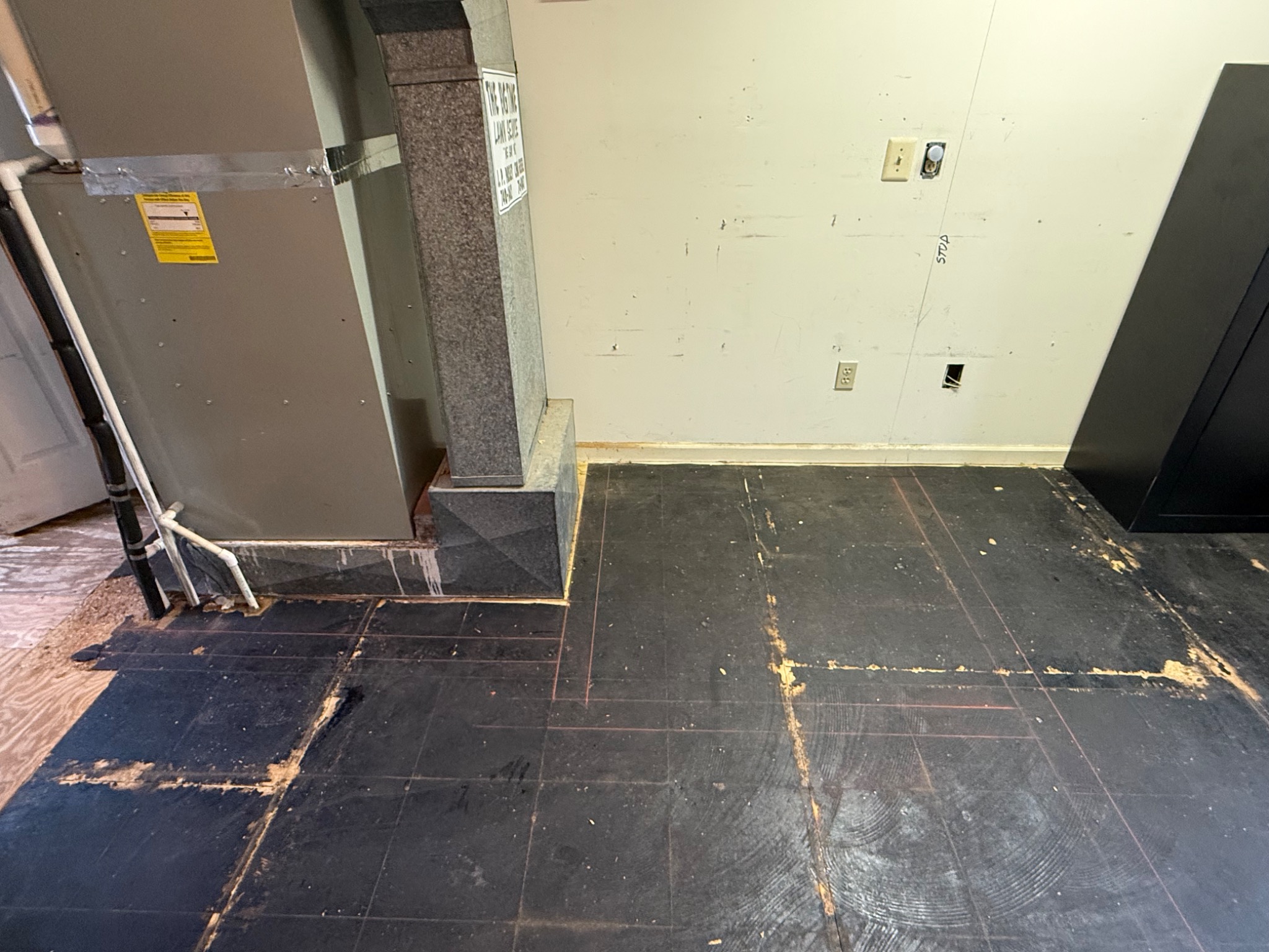 Original storage room floor and wall layout before renovation