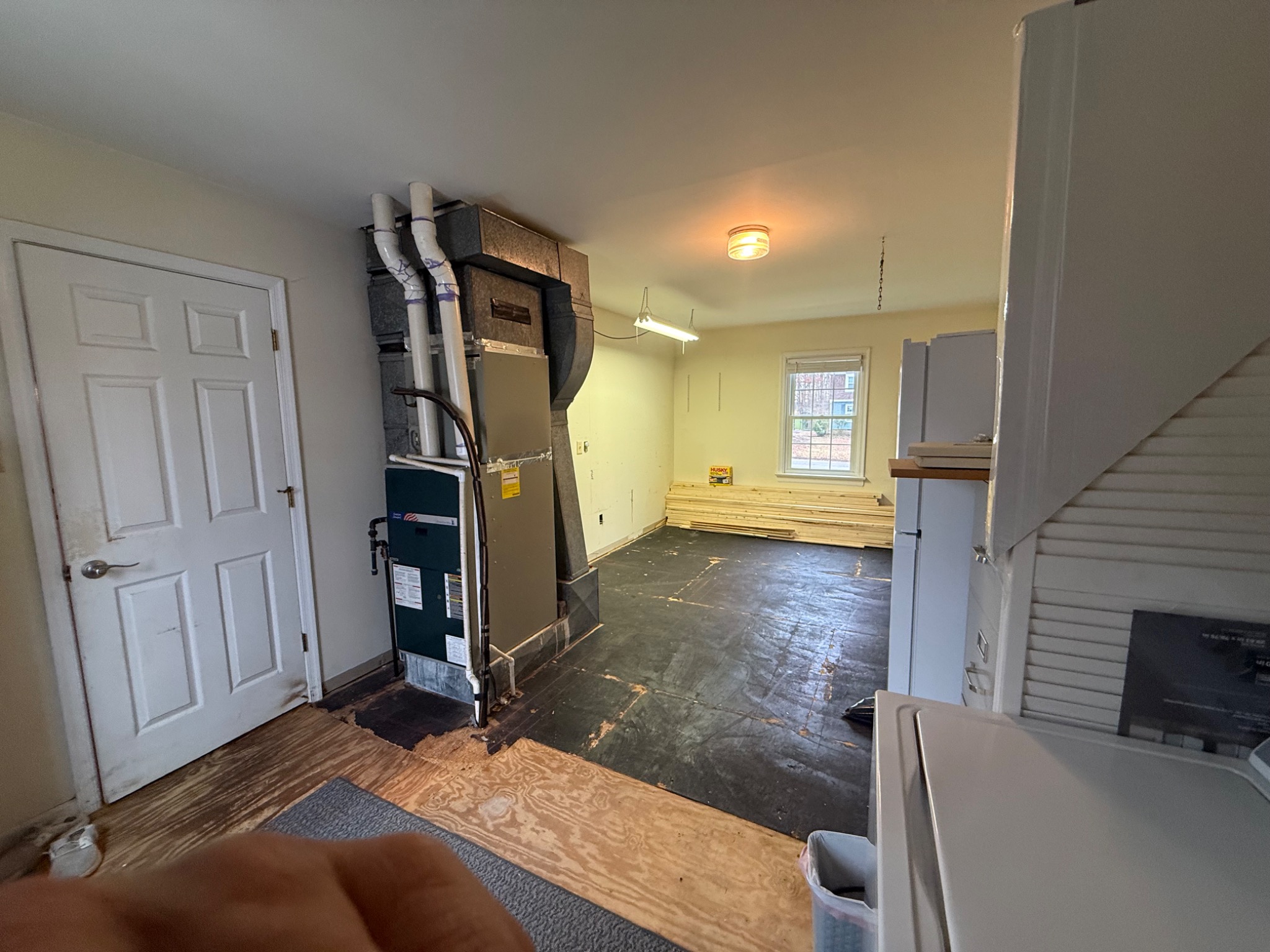Existing HVAC equipment and open storage area before enclosure work