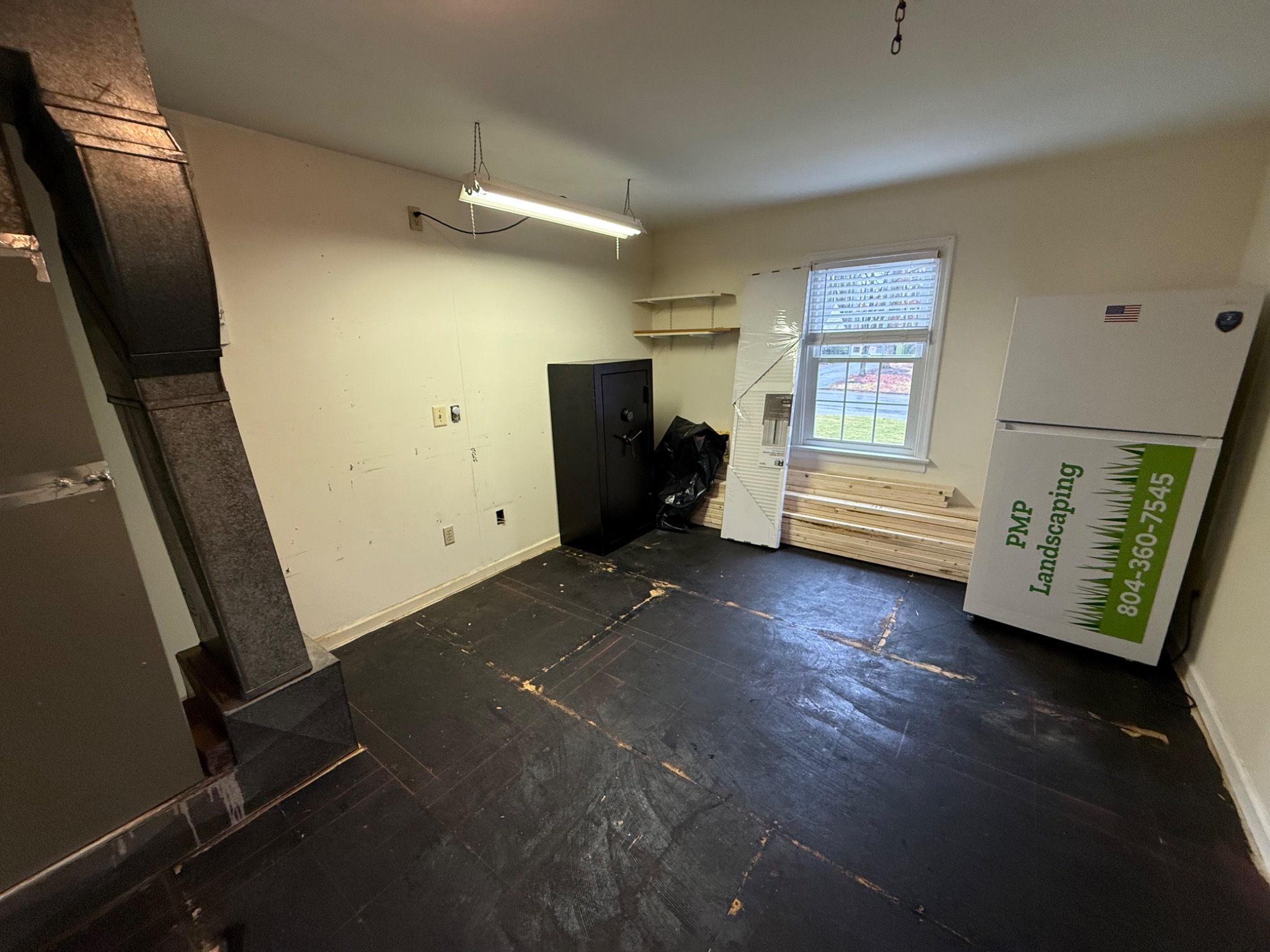 Existing 240 square foot storage and utility room before conversion to a home office