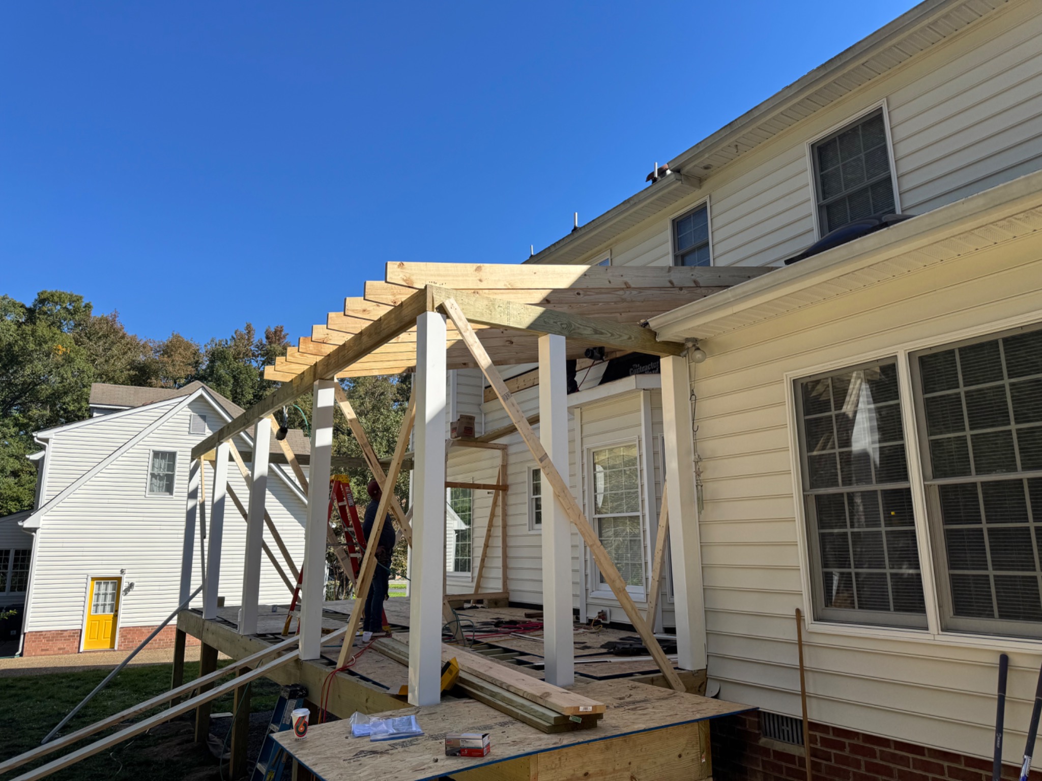 New porch floor and roof framing under construction