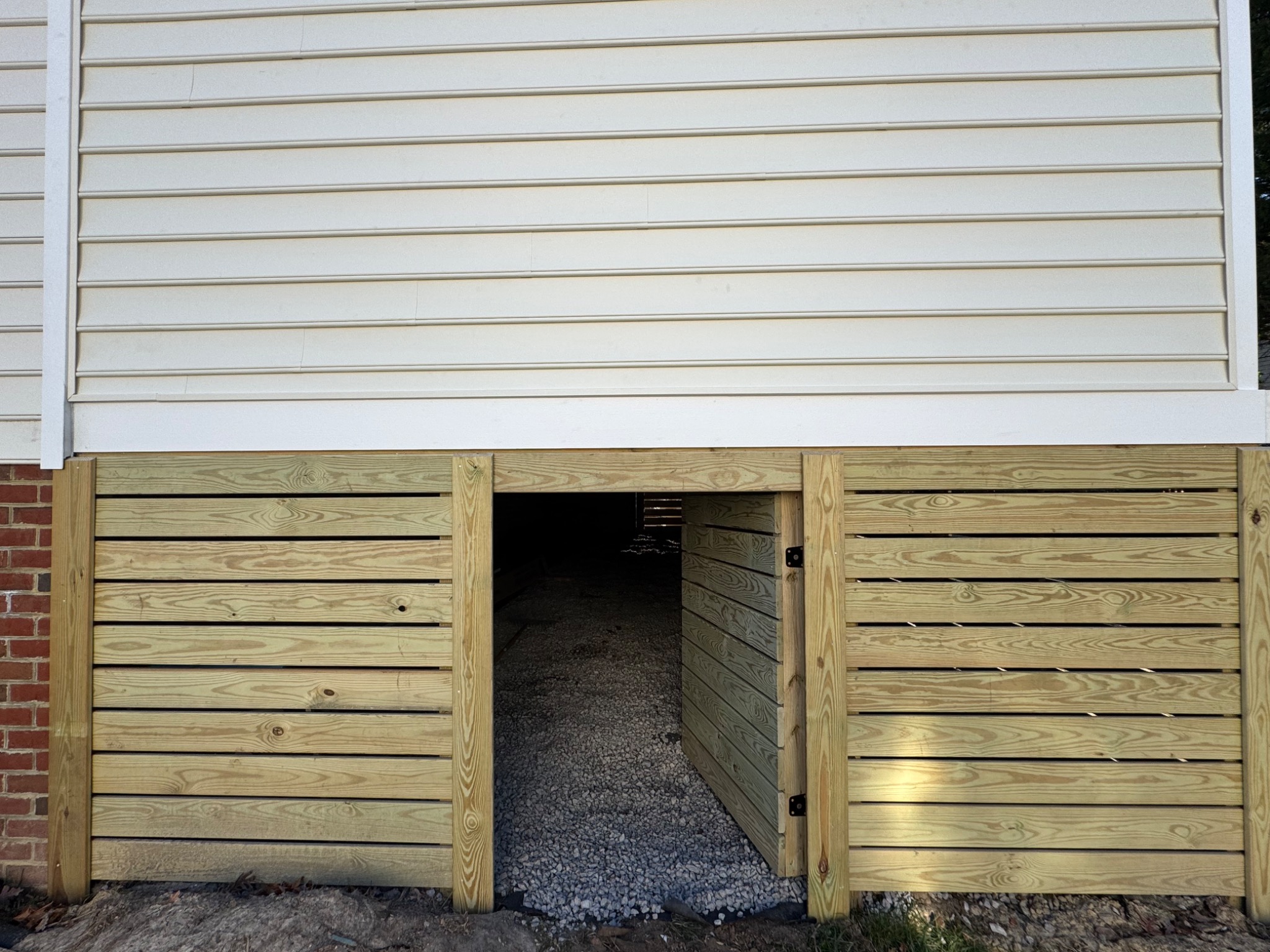 Detail view of horizontal wood skirting beneath the porch