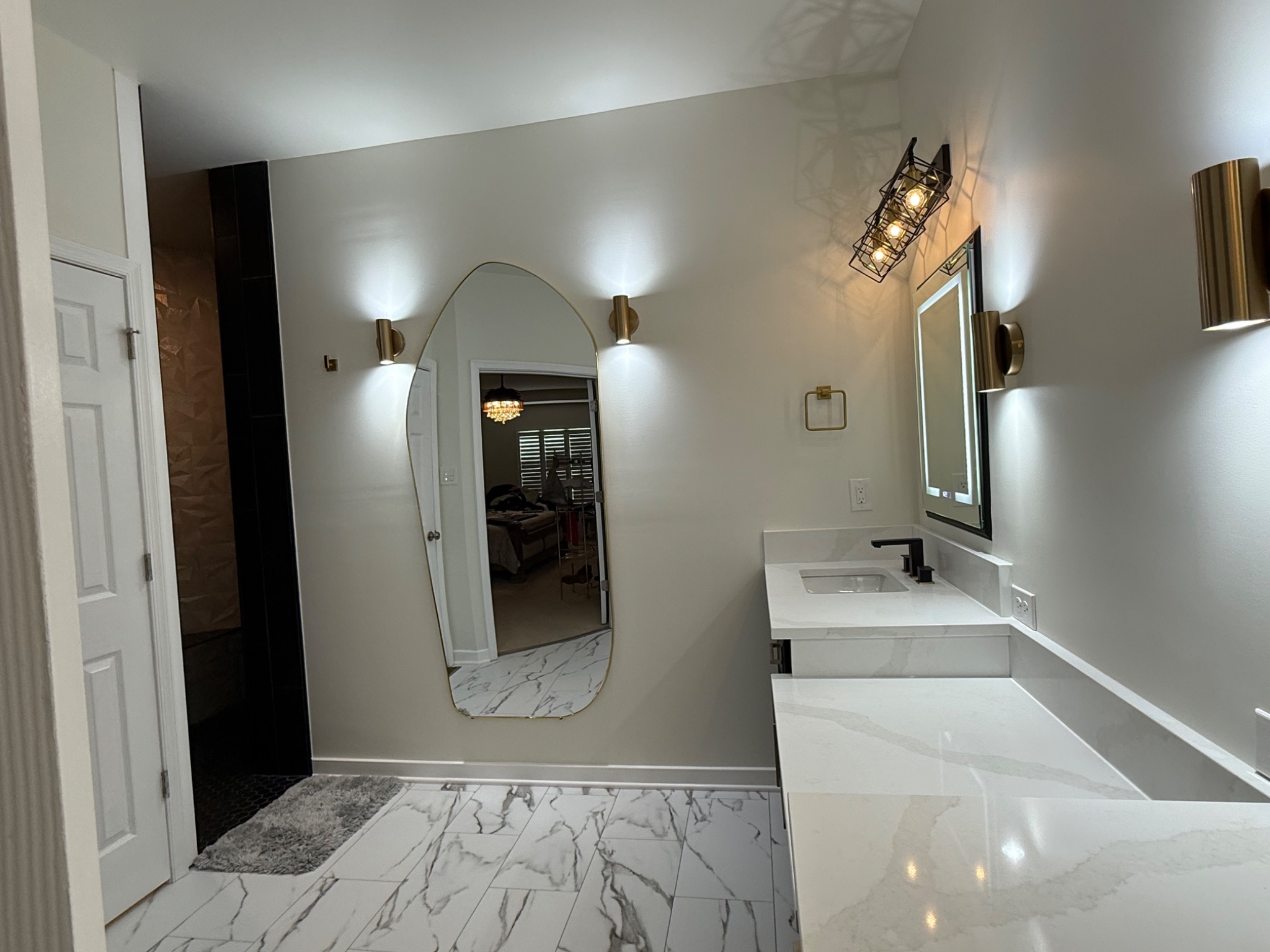 Finished quartz vanity countertops and marble-look bathroom floor