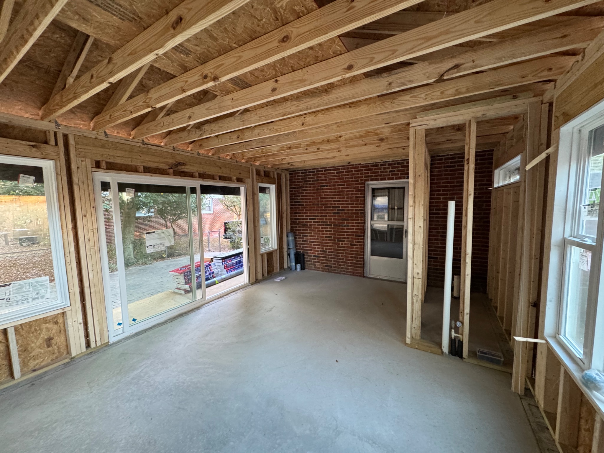 Sunroom framing with large sliding glass door opening