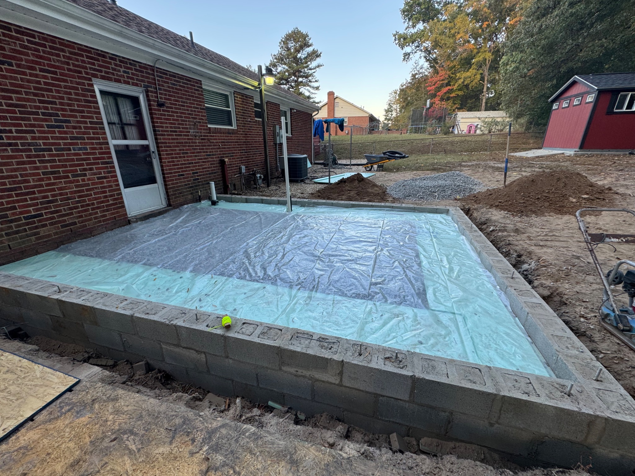 Foundation walls and vapor barrier preparation for sunroom addition slab